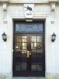 Stag beetle emblem above a door