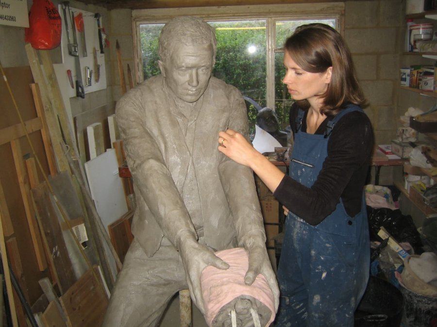 Hannar working on clay sculpture of Hauling Man