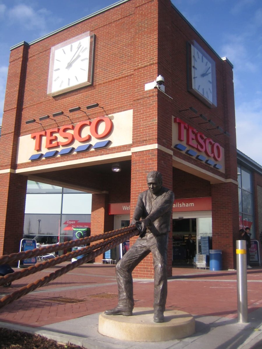 Hauling Man, life size bronze sculpture