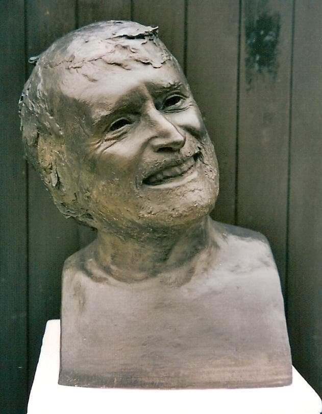 Life size bronze portrait bust of a laughing man