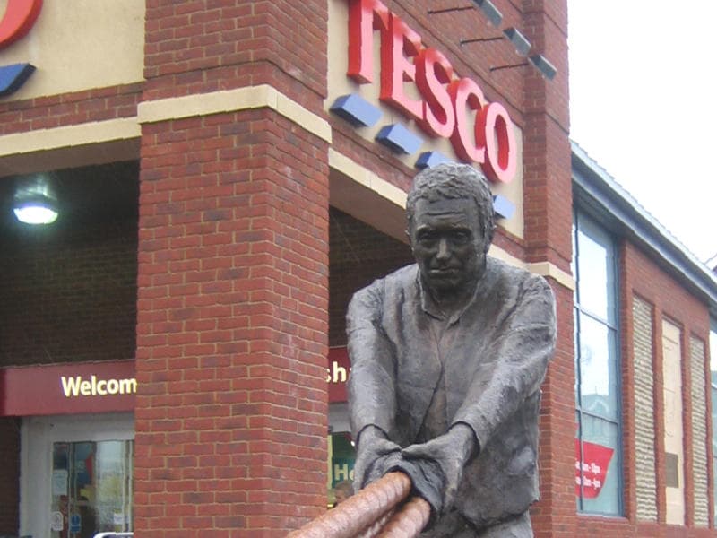 Hauling Man bronze sculpture